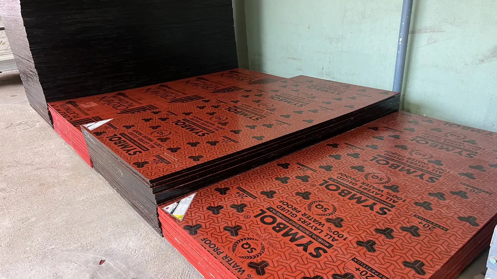 Stacks of film-faced centring shuttering plywood sheets ready for contractors at the Subramaniya Sawmill & Timber Mart depot in Kaveripattinam
